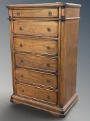 A reproduction six drawer chest, 87 cm x 55 cm x 142 cm.