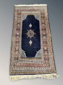 An Anatolian rug, 183 cm x 91 cm.