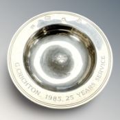A small silver bowl with inscription dated 1985, diameter 11 cm.
