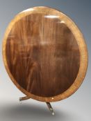 A good quality reproduction mahogany and satinwood banded circular folding breakfast table,
