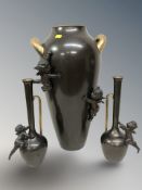 A reproduction patinated and gilt metal twin handled vase,