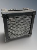 A Roland Cube 15X amplifier, with lead.