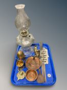 A clear glass oil lamp, brass mortar and pestle, pair of African style miniature spears,