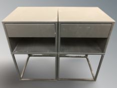 A pair of modern black bedside stands,