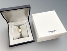 A Lady's Longines stainless steel and gold plated quartz wristwatch,