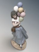 A Lladro figure of a lady with balloons No. 5141.