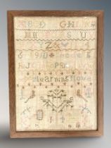 An old tapestry alphabet sampler 30 cm x 22.