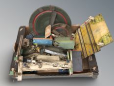 A group of tin plate model railway buildings and structures.