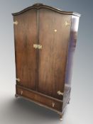 A 20th century mahogany double door dome top wardrobe, 93 cm W x 47 cm D x 168 cm H.