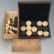 A Calvert / Persian style chess set, kings 5.5 cm, and a further set of chequers.