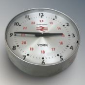 A Synchronome electric railway timepiece, diameter 23 cm.