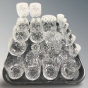 A group of crystal wine and brandy glasses, tumblers, pair of dwarf candlesticks, etc.