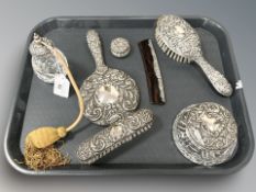 A seven piece silver dressing table set comprising of mirror, two brushes, comb, pill pot,