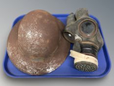 A tin helmet and a gas mask.