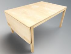 A Danish beech drop leaf extending coffee table,