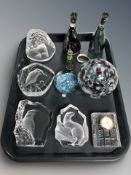 A group of clear glass animal paperweights, crystal quartz timepiece in the form of a book,