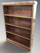 A continental walnut open bookcase, 85 cm W x 23 cm D x 119 cm H.
