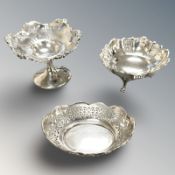 Two silver baskets and a further loaded silver example, height 7 cm.