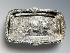 An embossed silver ring tray, width 11.5 cm. CONDITION REPORT: 32.9g.