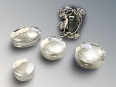 Four silver pill boxes and a small Art Nouveau easel frame, height 4.5 cm.