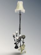 A wrought metal standard lamp, similar candle holder,