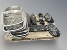 A quantity of vintage car parts to include Rover chrome grills, speedometers by Smiths,