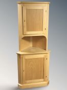 A contemporary Danish beech standing corner cabinet, height 179 cm.