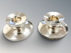 A pair of loaded silver squat candlesticks, height 3.5 cm.