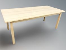 A Danish blond oak rectangular dining table,