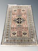 A Caucasian rug, 212 cm x 136 cm.