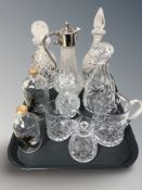 A group of crystal decanters, an EPNS mounted claret jug, etc.