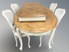 A French painted oak extending dining table with two leaves, overall approx.