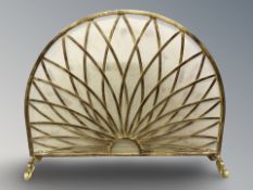 A decorative metal fire screen, width 99 cm.