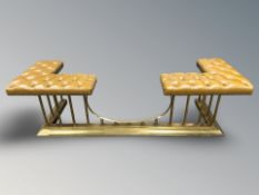 A reproduction brass and studded tan leather Chesterfield club fender,