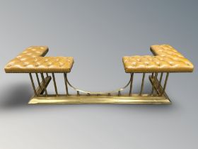 A reproduction brass and studded tan leather Chesterfield club fender,