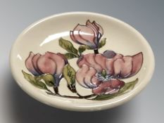 A Moorcroft Magnolia plate, diameter 26 cm.