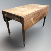 A regency style mahogany drop leaf sofa table, a threefold mahogany and satinwood mirror,