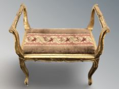 A continental gilt piano stool,