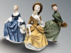 Three Royal Doulton figures 'Grace' HN2318, 'Hillary' HN2335 and 'Sandra' HN2275.