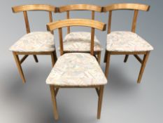 A set of four contemporary Danish teak chairs.