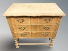 A continental oak serpentine-front four drawer chest,