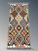 A Chobi Kilim runner, 149 cm x 65 cm.