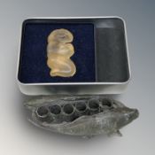A Chinese carved jade or similar clear hardstone fertility figure,