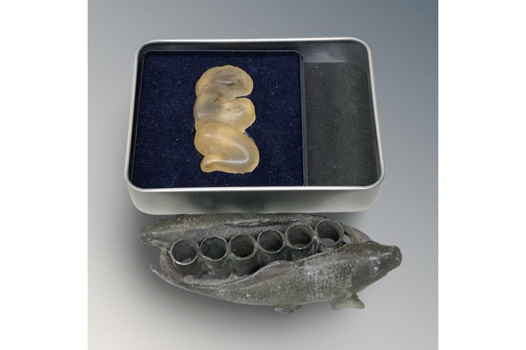 A Chinese carved jade or similar clear hardstone fertility figure,