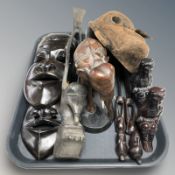 A group of tribal carved hardwood masks, figures, etc.