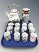 A reproduction Japanese porcelain square section tea pot on stand,