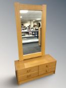 A Danish oak veneer and MDF four drawer low chest,