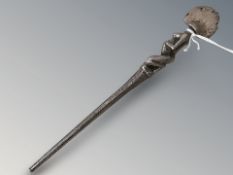A Luba (Democratic Republic of the Congo) white metal fertility staff finial, length 17 cm.