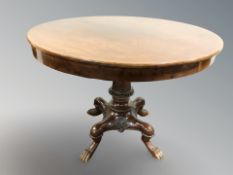 A continental mahogany circular breakfast table on carved paw feet, 100 cm diameter x 77 cm H.