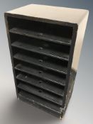 A lacquered open shelf,